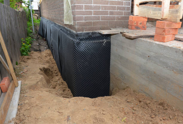 Happy homeowners after waterproofing job in Novelty